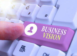 Writing note showing Business Vision. Business concept for grow your business in the future based on your goals © Zofia