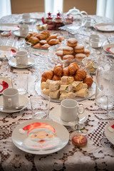 Christmas table decoration with tortillas, croissant and pies for brunch