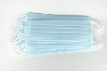 disposable blue medical mask on a white background