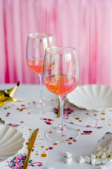 Cocktail in glasses . Elegant festive table setting in bright tones . Wedding, birthday, baby shower, girl party decoration.