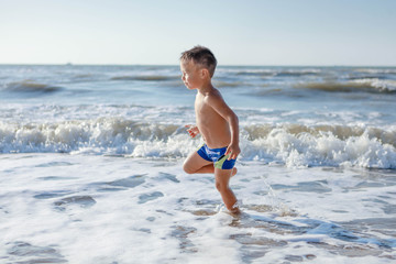 kid running on the beach
