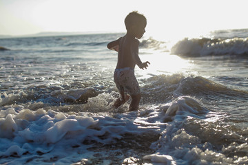 kid running on the beach