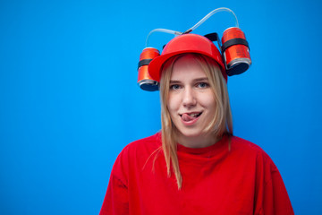 young girl fan licks her lips and flirts, the face of a sexy cheerleader with a beer hat