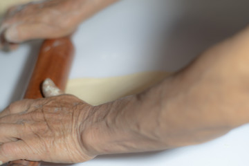 close up of a senior woman holding her hands