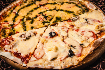 Pizza with cheese, mushrooms and sausage.