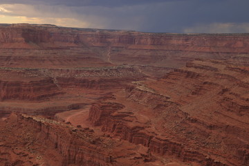 Fototapeta na wymiar Highway leading into Canyonlands National Park on a stormy afternoon from Dead Horse Point, Utah