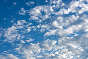 Bright blue dramatic cloudy sky on summer day.