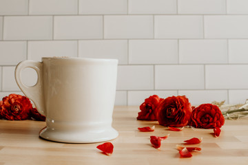 red flower and cup of coffee