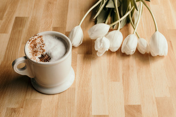cup of coffee on wooden table
