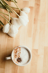 coffee tulips wooden background