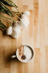 coffee tulips wooden background