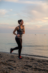 woman doing sports on the beach