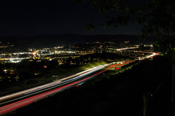 Fototapeta na wymiar Freeway Lights with City