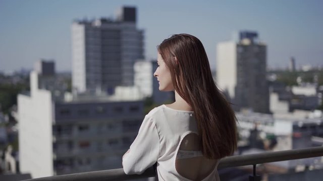 Girl going to take a break on her balcony