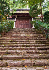 Fototapeta premium The stone steps leading to the rear gate of the Ryoan-ji temple. Kyoto. Japan