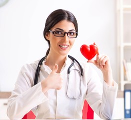 Young doctor in heart care concept