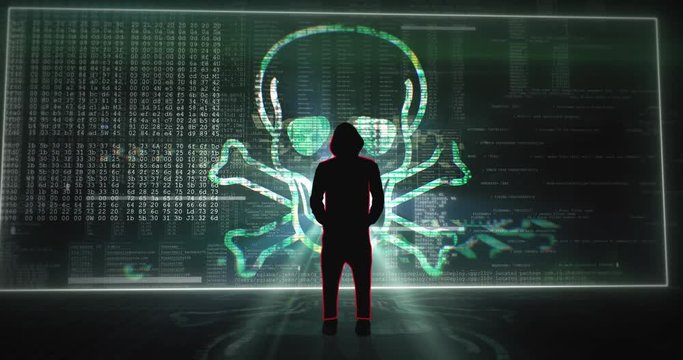 Silhouette of hooded hacker standing in front of a digital screen wall with a laughing virus skull. Camera approaching from behind.