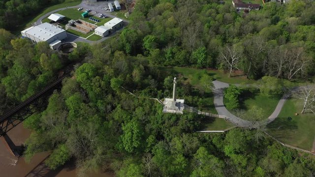 Aerial push in and tilt down onto the James Rumsey Monument in Shepherdstown, WV.