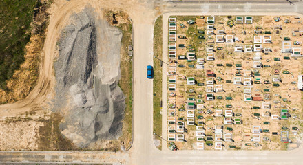 Aerial photo of new cemetery graveyard showing the headstones and tombstones of the graves some are with flowers long shadows from the coming sundown