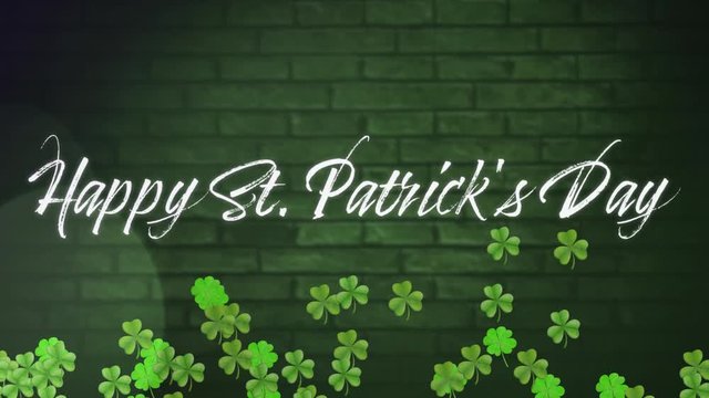Word Happy St. Patricks day with animation of green clovers moving