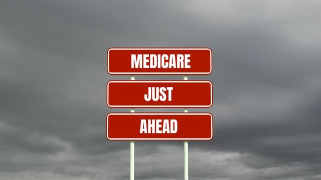 Animation of the words Medicare Just Ahead on road sign and clouds moving in background