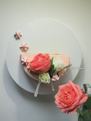 A pink carrot cake decorated with flowers, isomalt and meringues