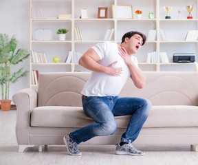 Sick man suffering at home from infection and bad stomach