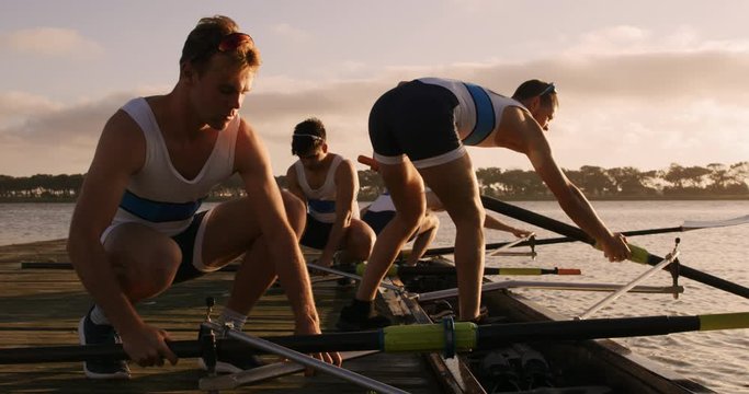 Male rower team preparing for training