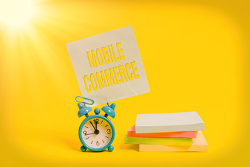 Handwriting text writing Mobile Commerce. Conceptual photo Using mobile phone to conduct commercial...