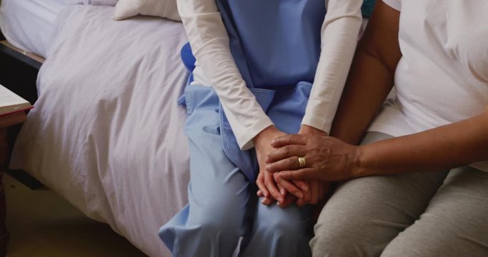 Nurse helping a senior woman in a retirement home