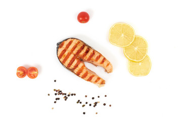 Grilled salmon steak isolated on white background