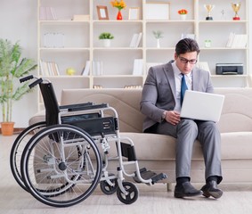 Dsabled businessman on wheelchair working home