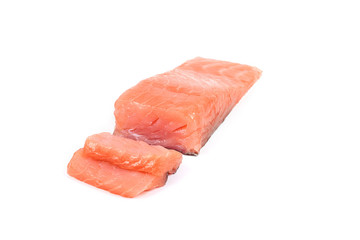Sliced salmon fillet isolated on white background.