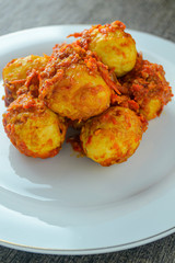 Telur balado (spicy eggs). indonesian food made from eggs, chili, tomatoes, garlic and other and other ingredients