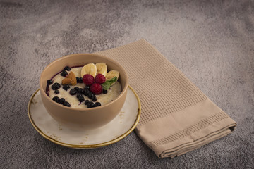 Oatmeal in a plate on a background