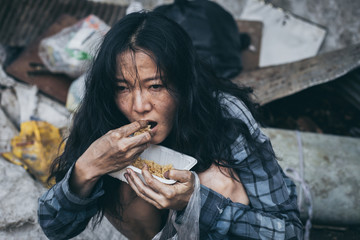 poor people,homeless or beggar begging for help sitting at dirty slum.concept for poverty...