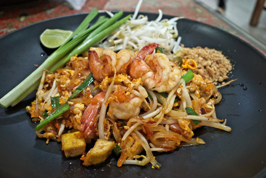 Classic Pad Thai (Phad Thai) is traditional cuisine in Thailand ,is stir-fried rice noodle dish with shrimps ,tofu ,scrambled egg ,bean sprouts seasoning with pad thai sauce