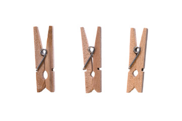 Set of decorative wood beige clothespins isolated on white background. Macro, closeup