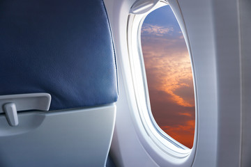 View From Airplane Window,view Sunset or azure sky and clouds from window of airplane