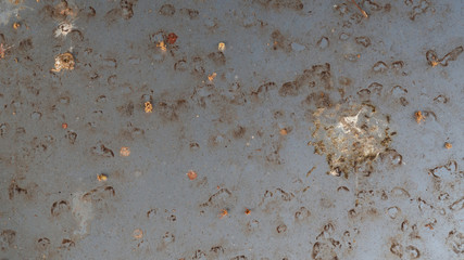 The dirt on the car that consists of the lever