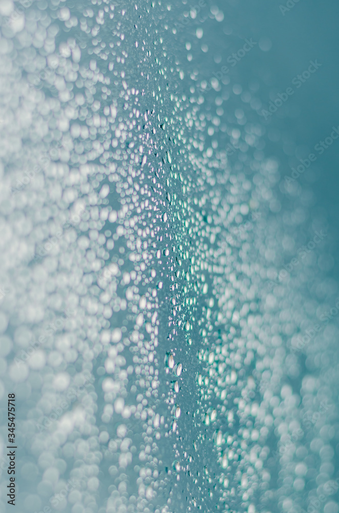 Wall mural blurred and focus of rain drop on glass window in monsoon season for abstract and background concept