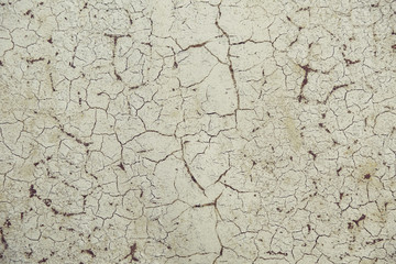 cracks on old paint on rusty metal. beautiful backdrop with cracks on the wall