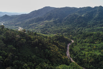 Fototapeta na wymiar Deep waterfall river mountain green forest aerial view