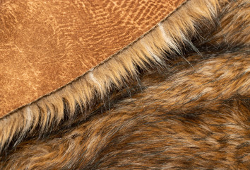 Close-up of a fluffy dark brown faux fur fabric with a background texture.