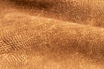 brown faux suede leather for the concept and style idea of fine leather craft, handmade work space.