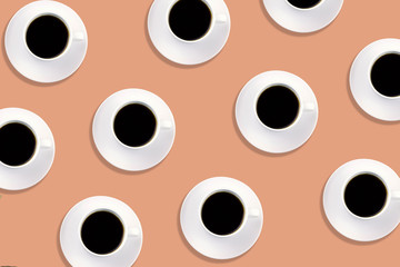 top view white cups with black creative pattern on an orange background