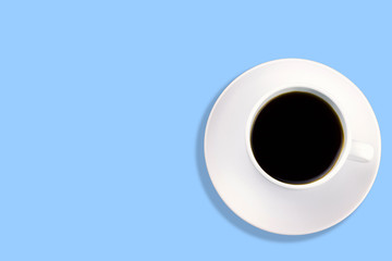 top view white coffee cup on a blue background copy space