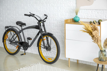 Interior of modern room with commode and bicycle