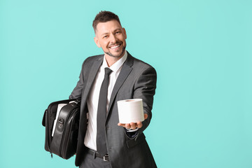 Businessman with toilet paper in bag on color background. Concept of coronavirus epidemic