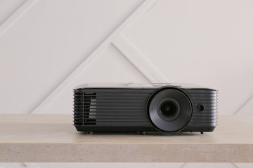 Video projector on table in conference hall